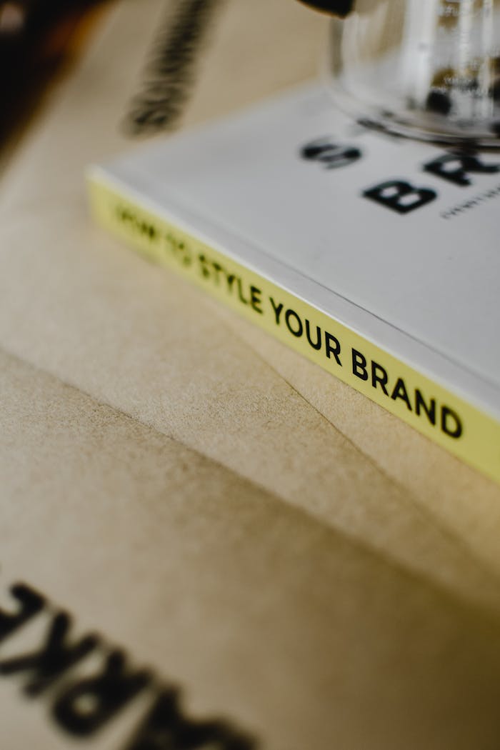 A close-up of a book titled How to Style Your Brand on a paper background.